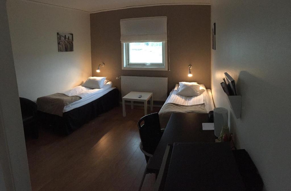 Postel nebo postele na pokoji v ubytování Hotel E-10 by First