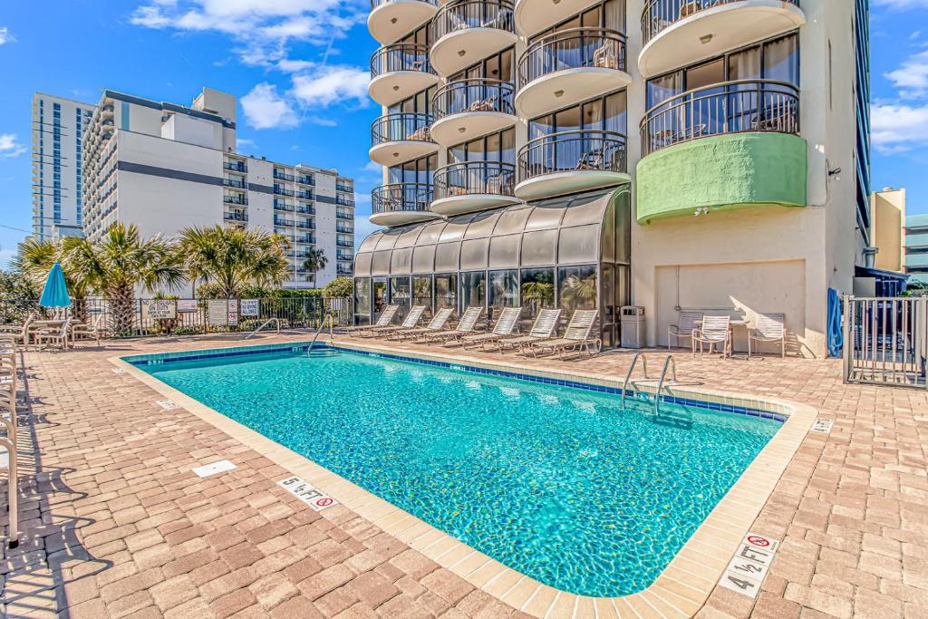 a swimming pool in front of a building at Ocean View Double Suite! Sleeps 4 Meridian Plaza 705 in Myrtle Beach