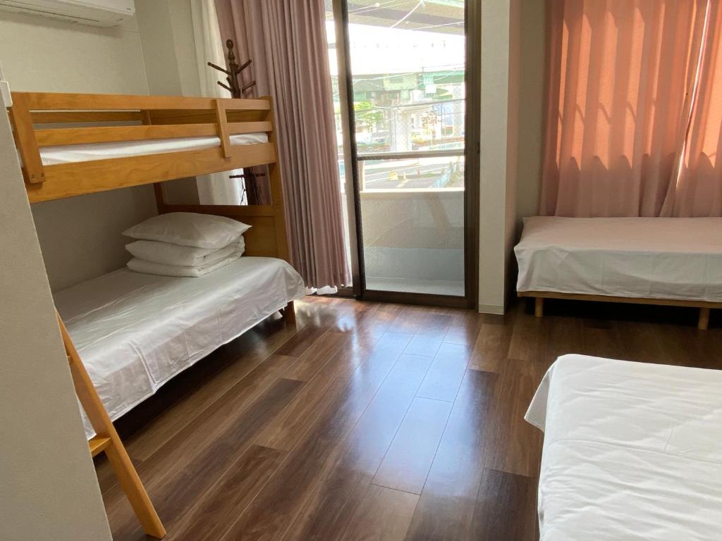 Postel nebo postele na pokoji v ubytování 名古屋市中心步行所到的独栋房子免费停四辆车