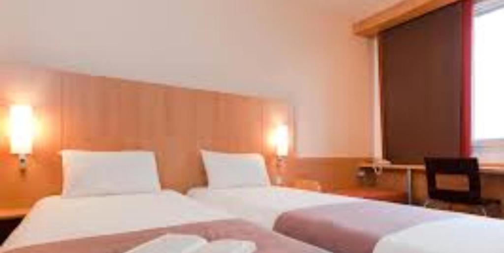 Postel nebo postele na pokoji v ubytování Hôtel lhamra