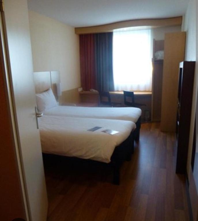 Postel nebo postele na pokoji v ubytování Hôtel lhamra