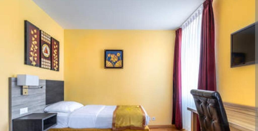 TV a/nebo společenská místnost v ubytování Hôtel lhamra