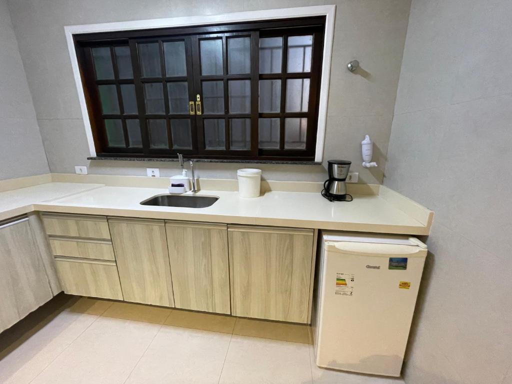 Kuchyň nebo kuchyňský kout v ubytování Pousada Chilli Brasil