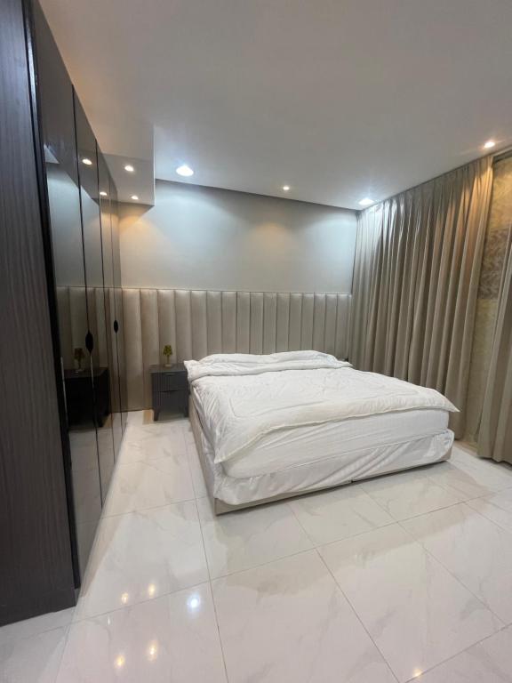Postel nebo postele na pokoji v ubytování سويت ابارت للشقق الفندقية