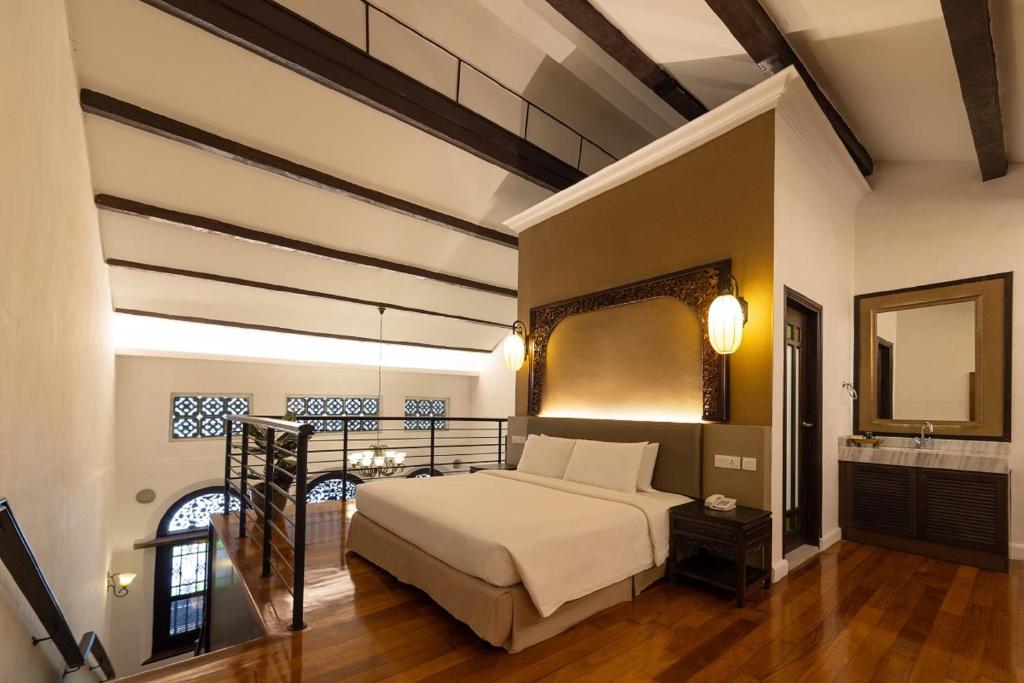 Postel nebo postele na pokoji v ubytování Hotel Puri Melaka