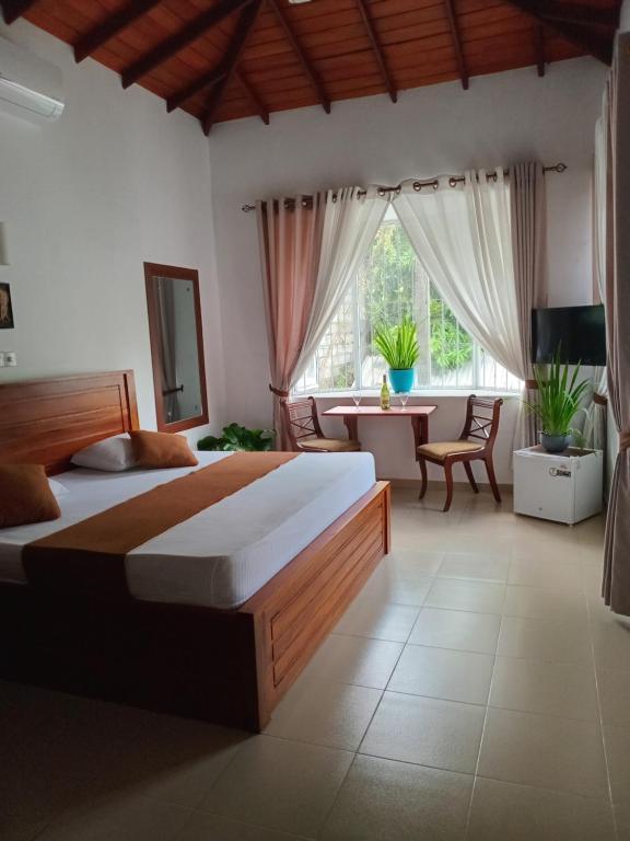 Postel nebo postele na pokoji v ubytování Jal,Min Homestay
