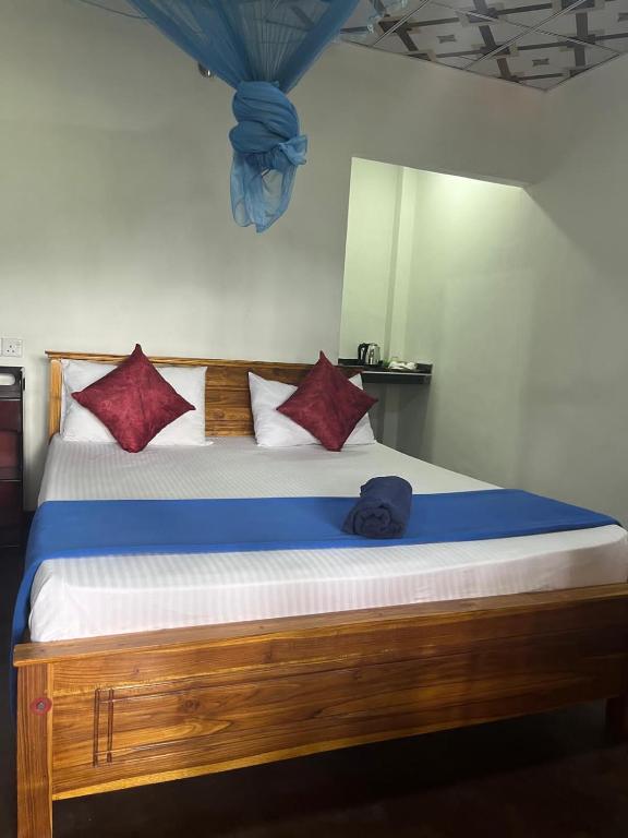 Postel nebo postele na pokoji v ubytování Himansa Homestay