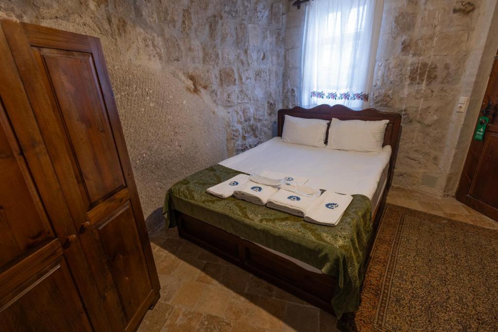 Postel nebo postele na pokoji v ubytování Gedik Cave Hotel