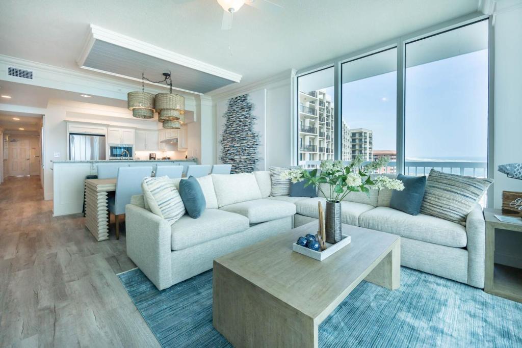 a living room with a couch and a table at Perdido Dunes Tower 9E condo in Orange Beach