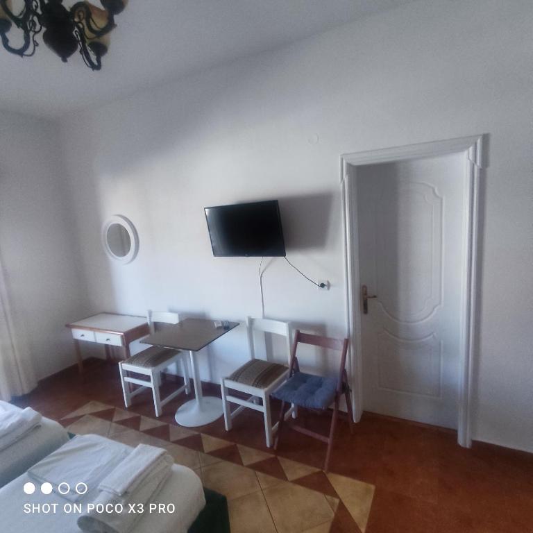 Uma televisão e/ou sistema de entretenimento em Apartment Rina