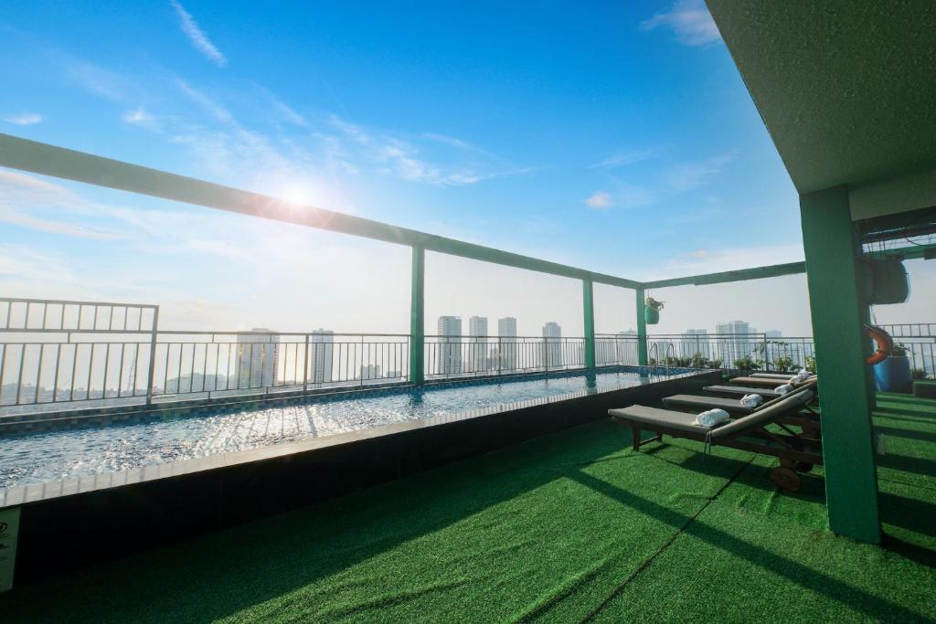 a balcony of a building with a view of the city at Napoleon Nha Trang Hotel in Nha Trang