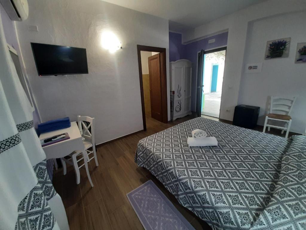 Postel nebo postele na pokoji v ubytování Borgo Rurale Cares