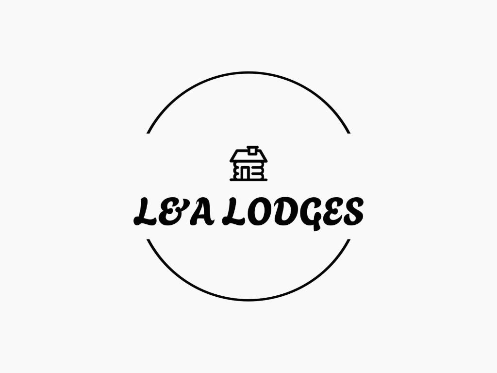 a circle with the text la ladders written inside it at L and A Lodges in Port Talbot