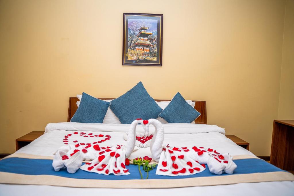 Llit o llits en una habitació de Hotel Glory Garden