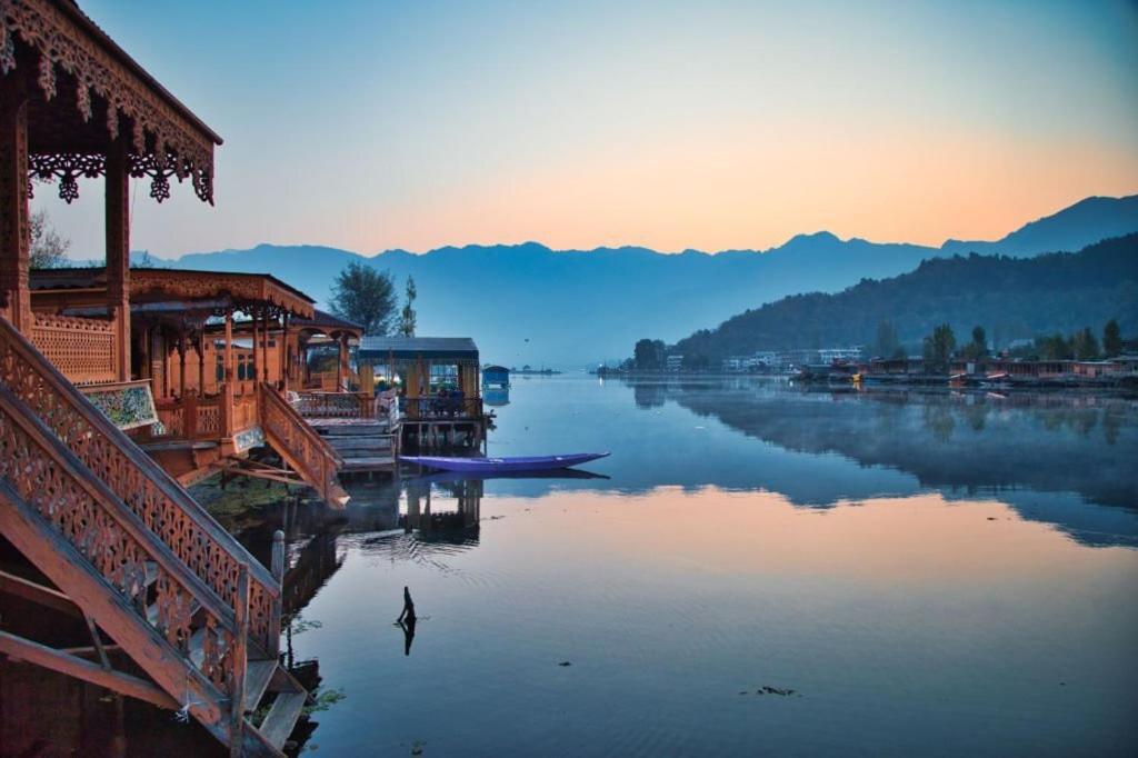 a view of a body of water with houses on it at Lakes Crown Group Of Houseboats in Srinagar