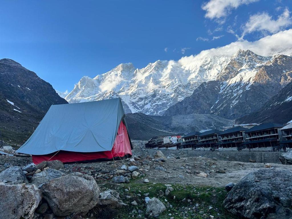 a tent on a mountain with mountains in the background at Kedar Tent House in Kedārnāth