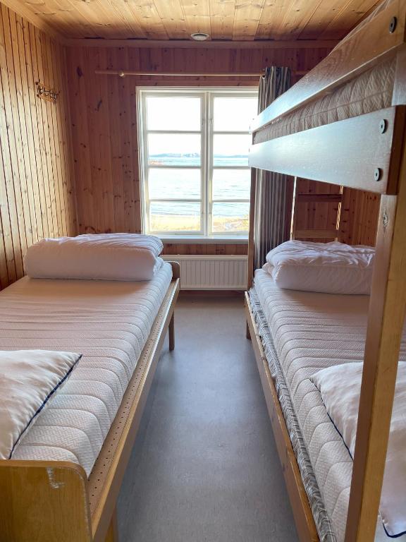 Postel nebo postele na pokoji v ubytování Sandvikens Fiskeläge Ulvön