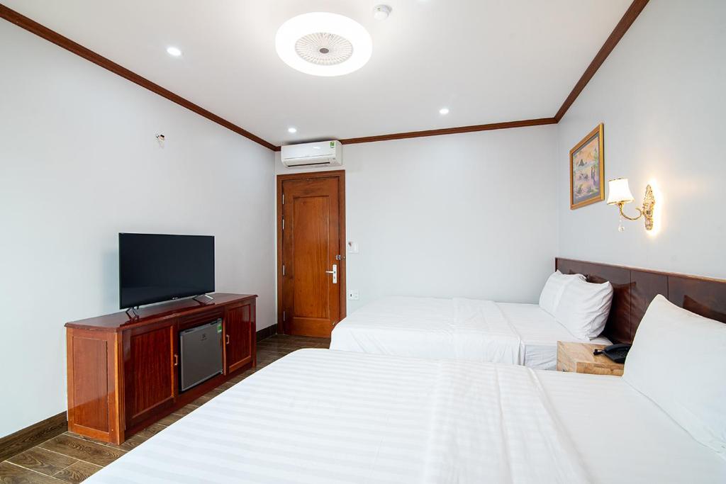 TV a/nebo společenská místnost v ubytování Minh Quang Hotel