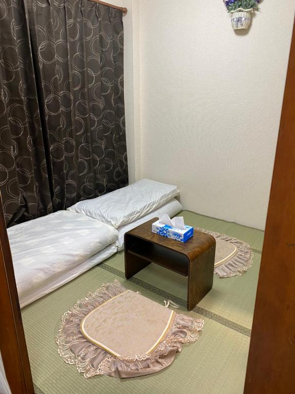 Postel nebo postele na pokoji v ubytování 辣椒民宿