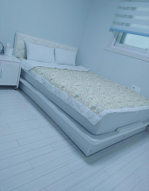 Postel nebo postele na pokoji v ubytování Cobe Guesthouse Dongdaemun