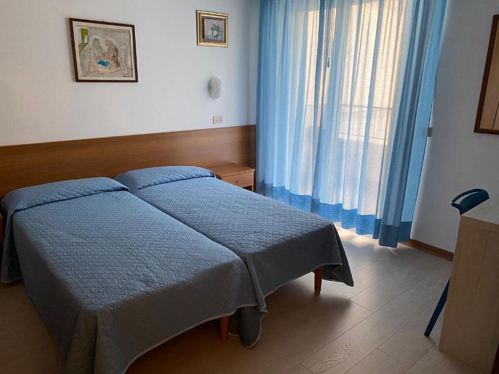 Postel nebo postele na pokoji v ubytování Hotel Meublè Villa Patrizia