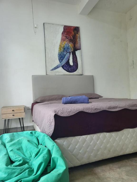 Postel nebo postele na pokoji v ubytování Hasthi homestay