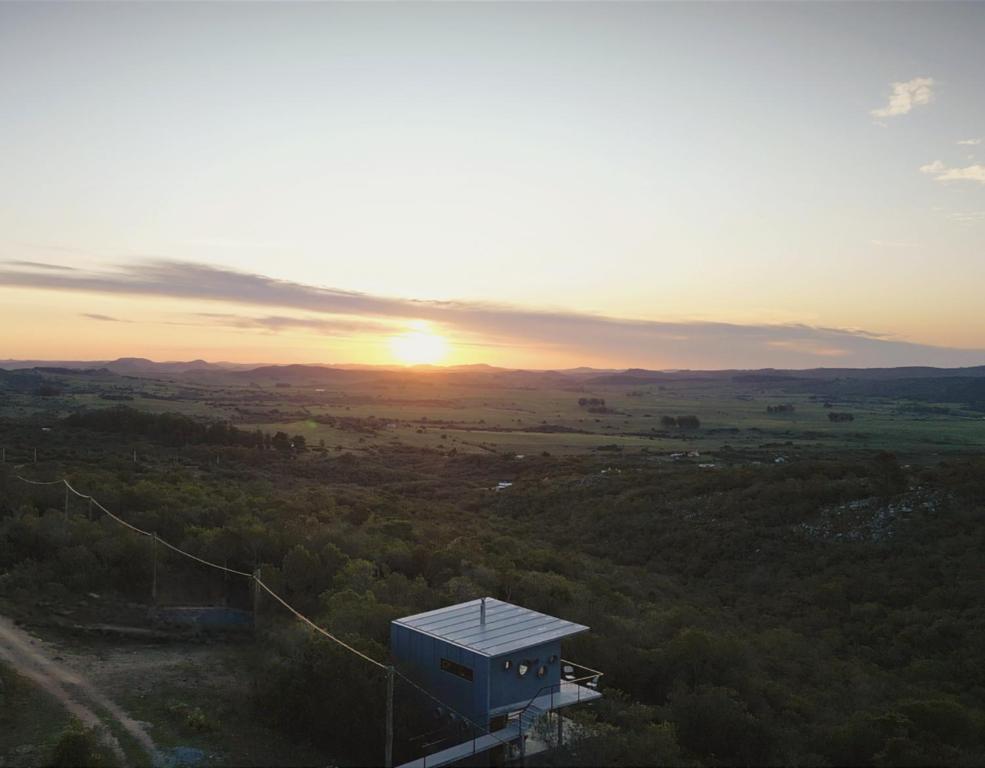 a view of the sunset from a lookout tower at Gran Vista y Tranquilidad in Villa Serrana