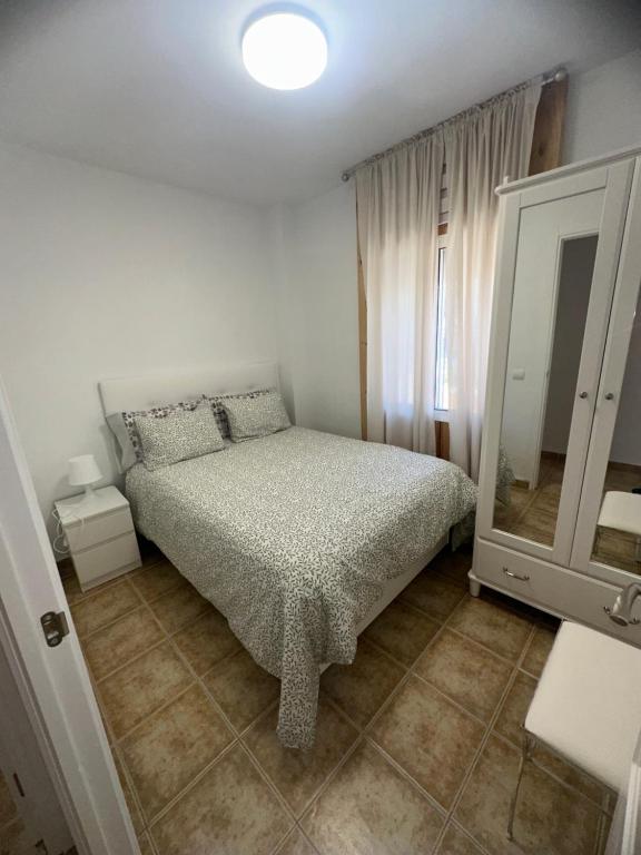 Tempat tidur dalam kamar di Apartamento Patricia