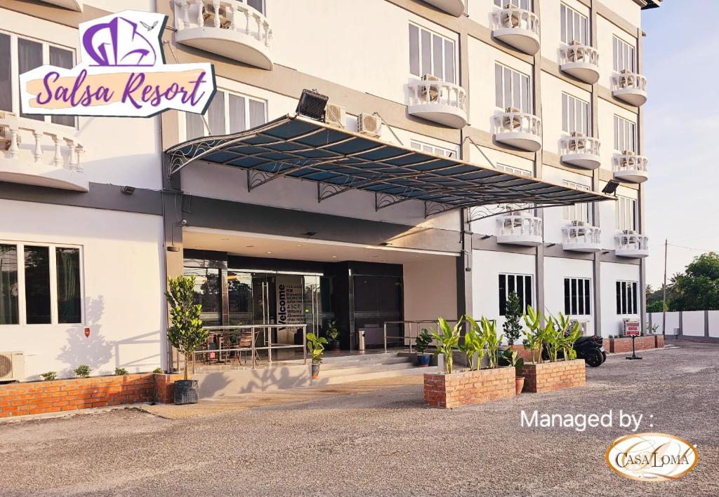 a exterior view of a building with awning at Salsa Resort Langkawi By Casa Loma in Pantai Cenang