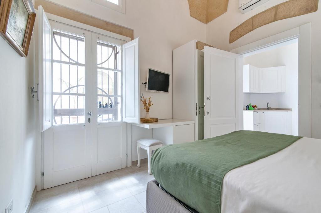 Postel nebo postele na pokoji v ubytování Tancredi Suites - Lecce Selection