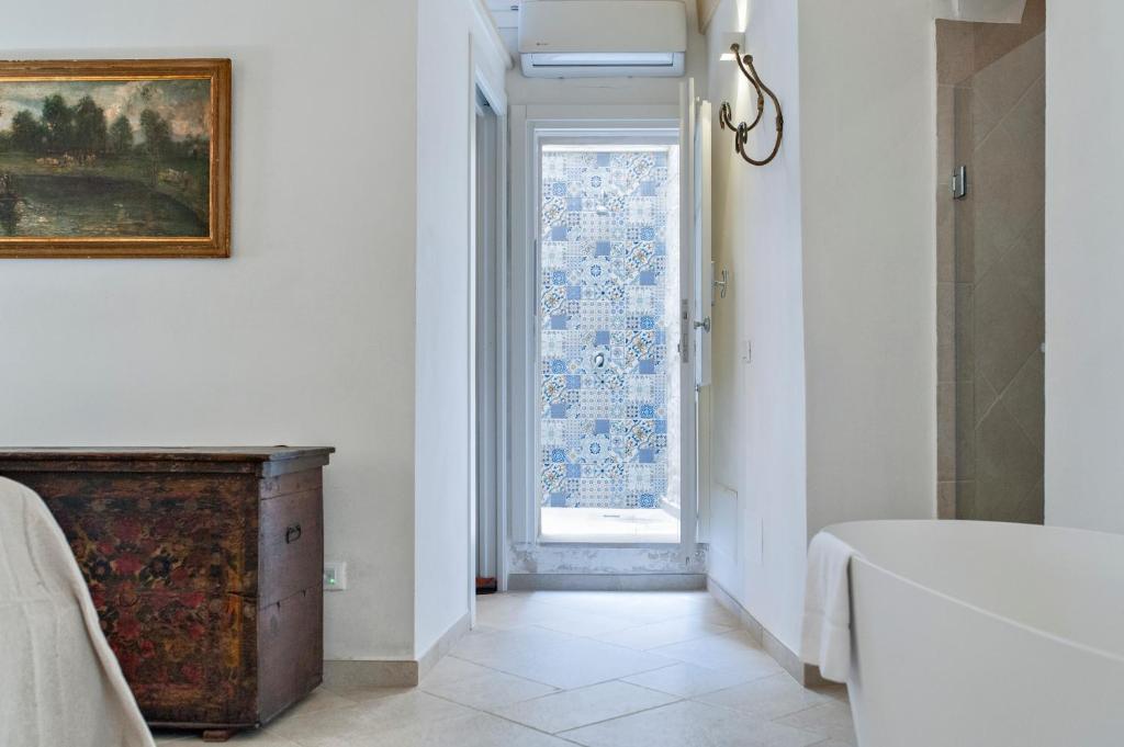 Postel nebo postele na pokoji v ubytování Tancredi Suites - Lecce Selection