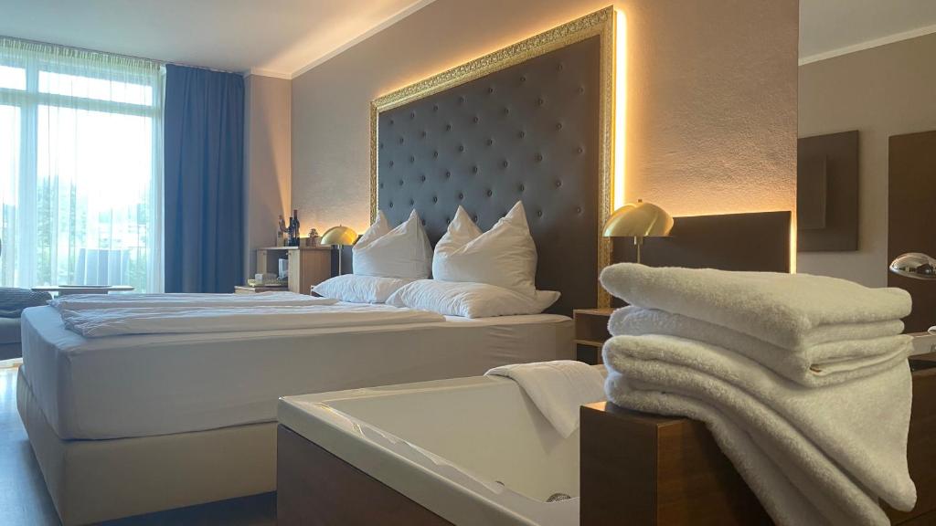 Postel nebo postele na pokoji v ubytování Weinresidenz Sonnleitner - ADULTS ONLY