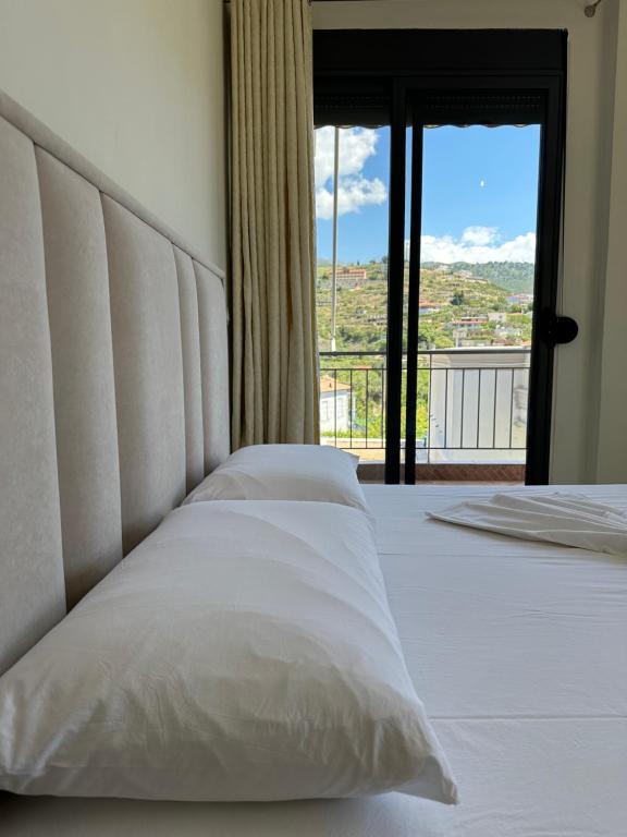 Postel nebo postele na pokoji v ubytování Bora Rooms