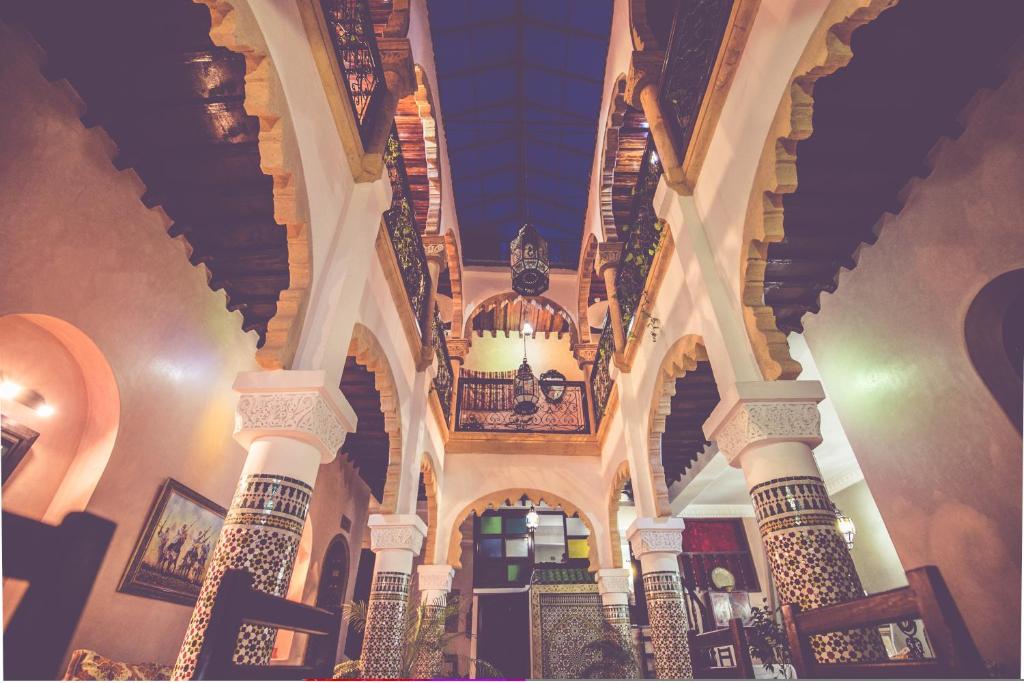 a building with a spiral staircase in a building at Riad Dar Alia in Rabat