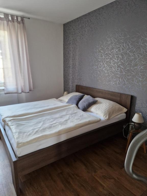 Postel nebo postele na pokoji v ubytování Apartmán Eliášova