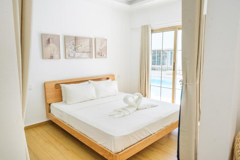 Uma cama ou camas num quarto em Seapearl of Alona