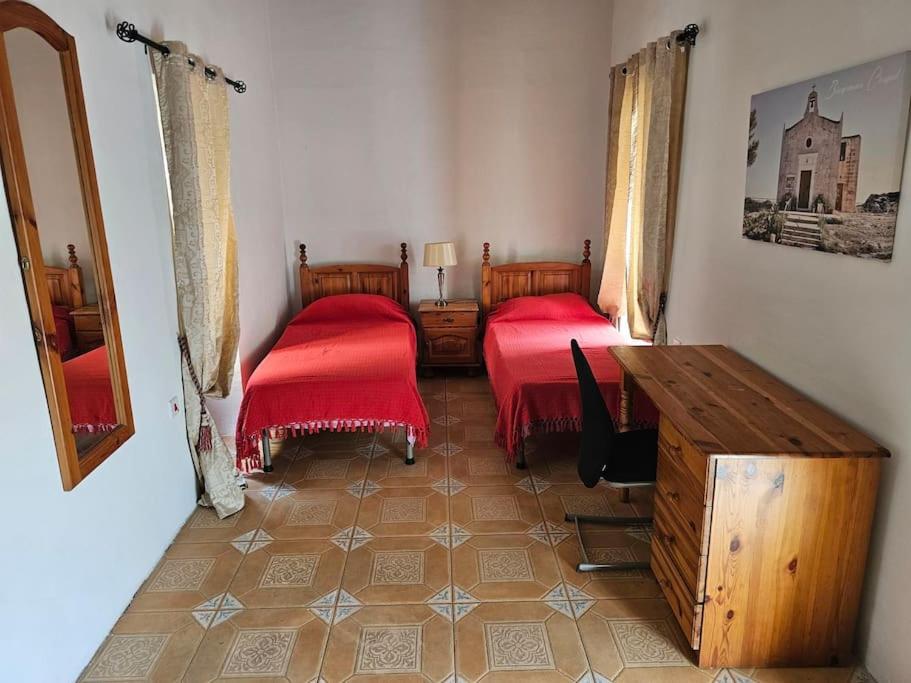 מיטה או מיטות בחדר ב-Nice House of caractere in Qormi