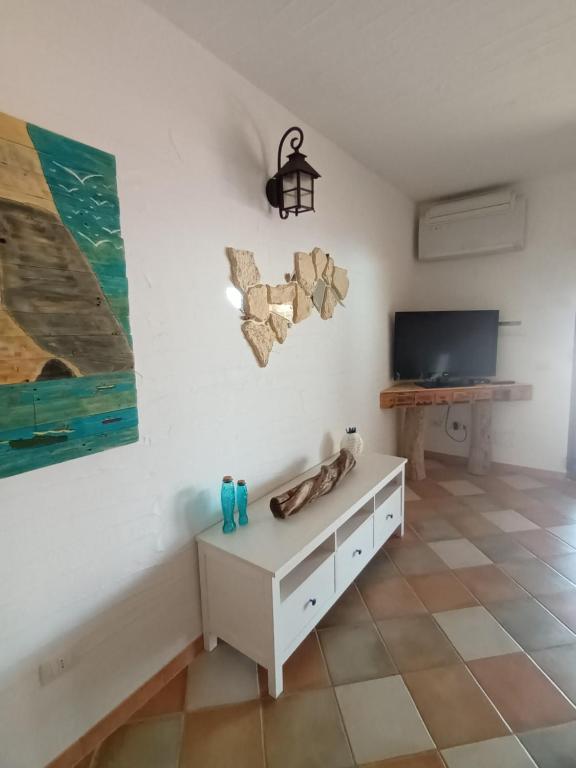 A television and/or entertainment centre at La Villa Tanca Piras