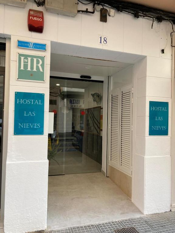a hospital has nhs signs on the side of a building at Hostal Las Nieves in Ibiza Town