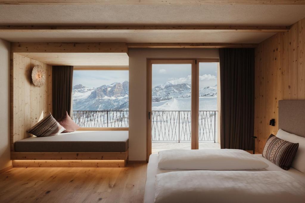 Postel nebo postele na pokoji v ubytování Rifugio Alpino Pralongià