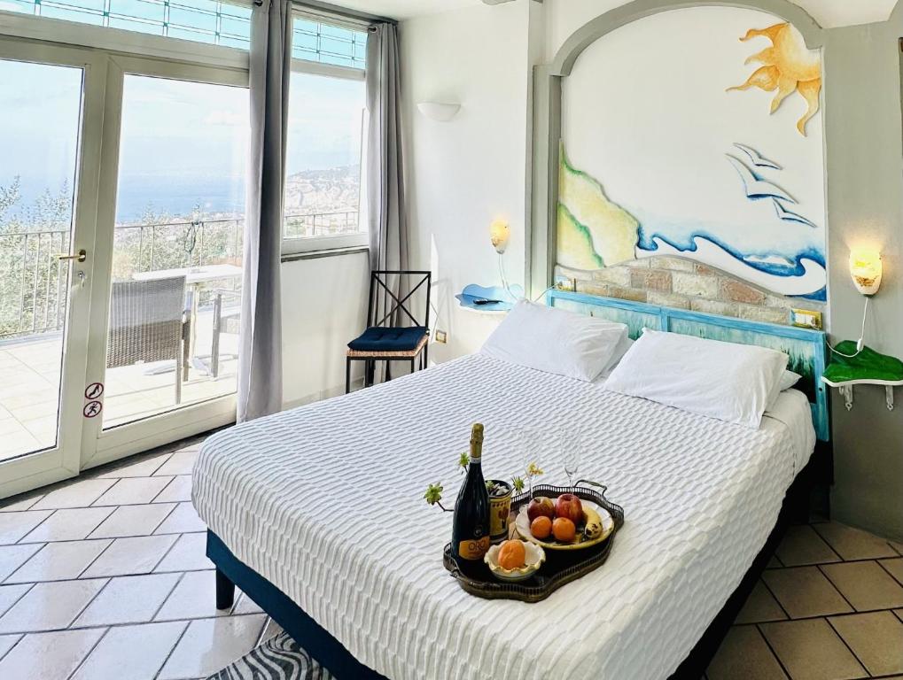 a bedroom with a bed with a bowl of fruit on it at Casa Mazzola in Sant'Agnello