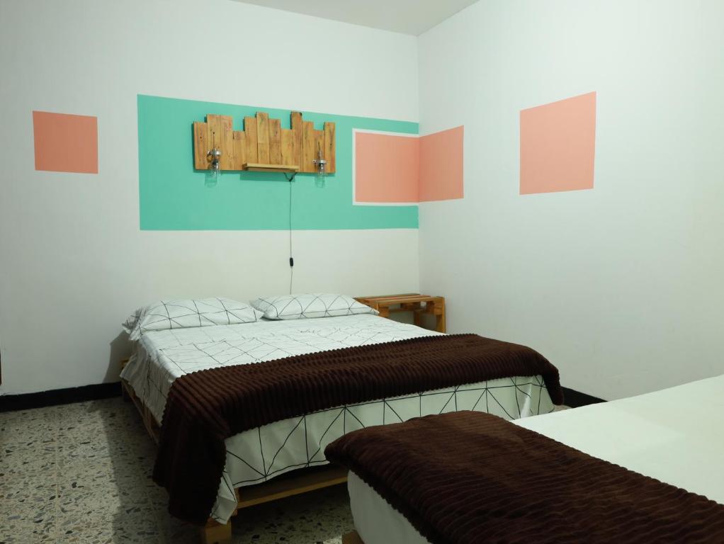 Postel nebo postele na pokoji v ubytování Hostal paz y vida