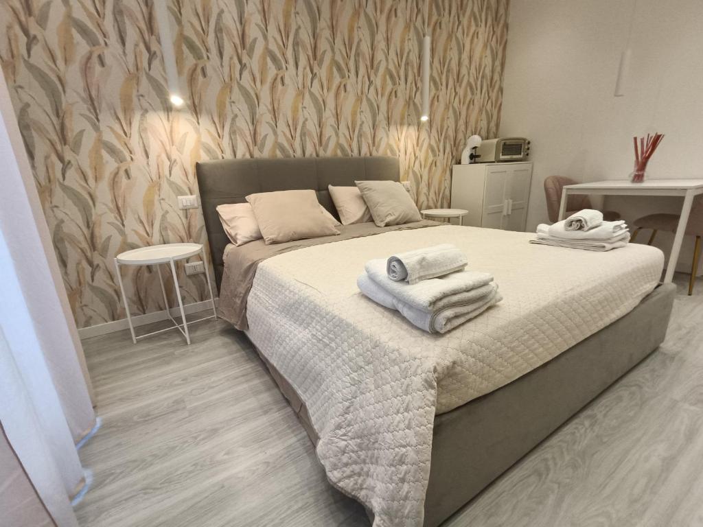 Postel nebo postele na pokoji v ubytování BlancoHouse - Nido d'amore sul Parco