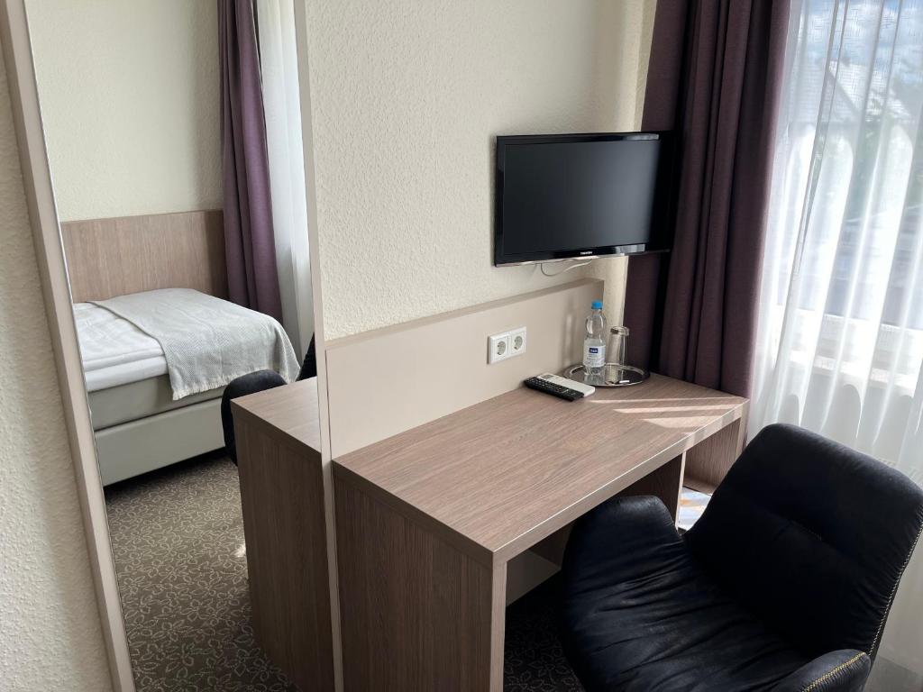 TV a/nebo společenská místnost v ubytování Hotel Zum Ritter