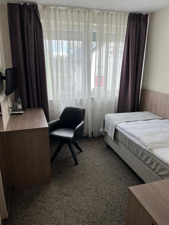 Postel nebo postele na pokoji v ubytování Hotel Zum Ritter