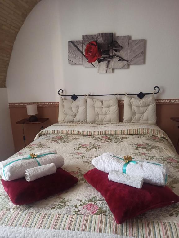 a bedroom with a bed with two towels on it at Il Conte di Cavour in Lanciano