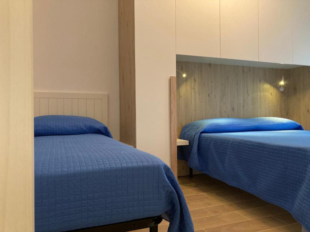 Postel nebo postele na pokoji v ubytování Appartamenti Laura