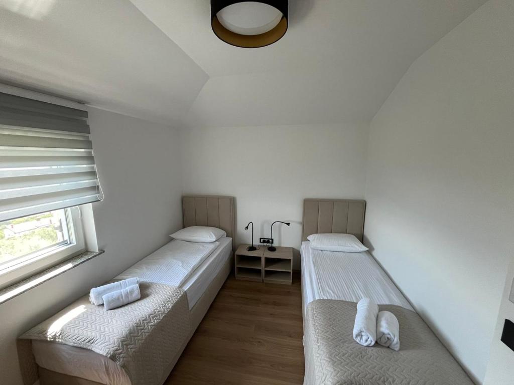 Postel nebo postele na pokoji v ubytování Villa ELM