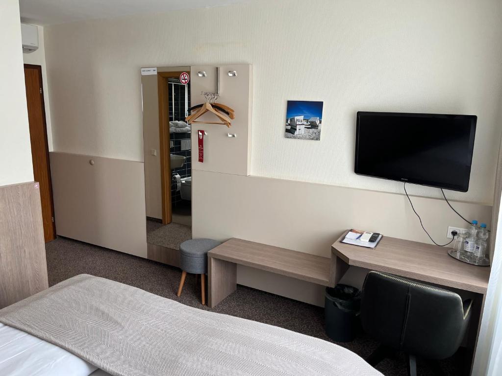 TV a/nebo společenská místnost v ubytování Hotel Zum Ritter
