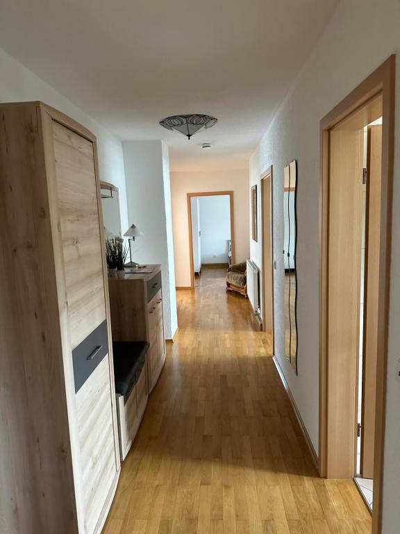 a hallway of a house with a wooden floor at Ferienwohnung an der Lauchert in Gammertingen